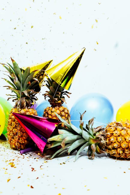 Vibrant party scene with pineapples, balloons, and confetti, perfect for celebration themes.